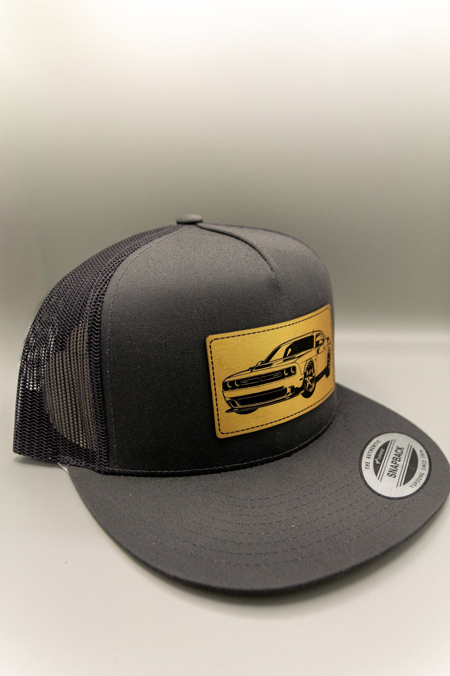 Dodge Challenger Charcoal Flat Trucker Cap with Gold Leatherette Patch