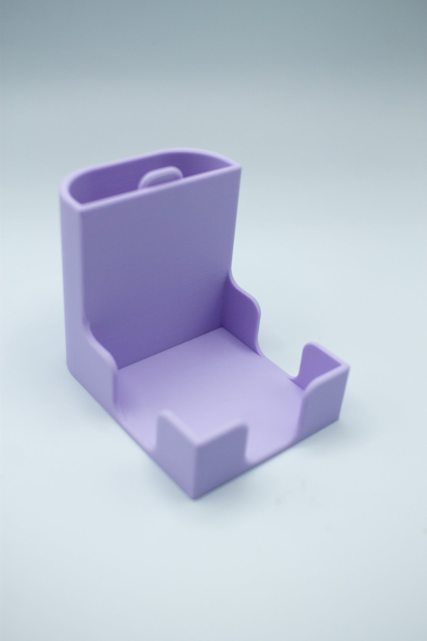 Purple post-it holder on a light gray background
