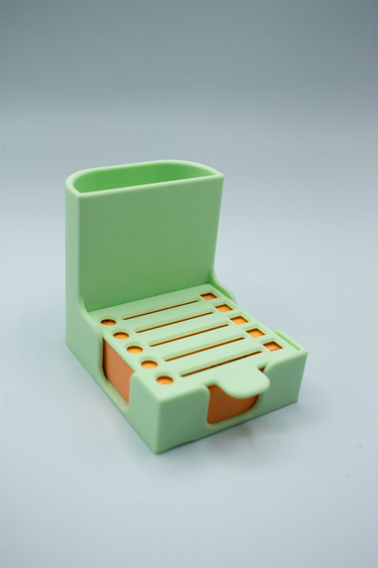 mint green post-it holder with to-do list stencil on a light gray background